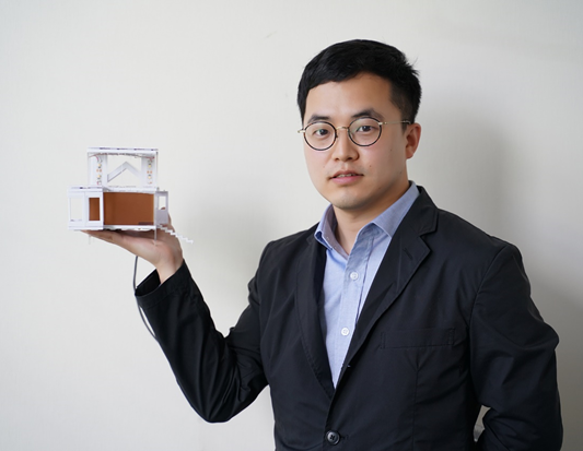 Yuan Gao and his demonstration house model